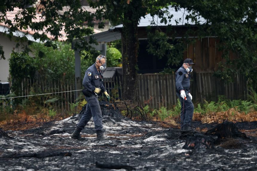 Bomb disposal experts work on a site after the discovery of shells from World War II in a neighborhood of Le Porge on Monday.