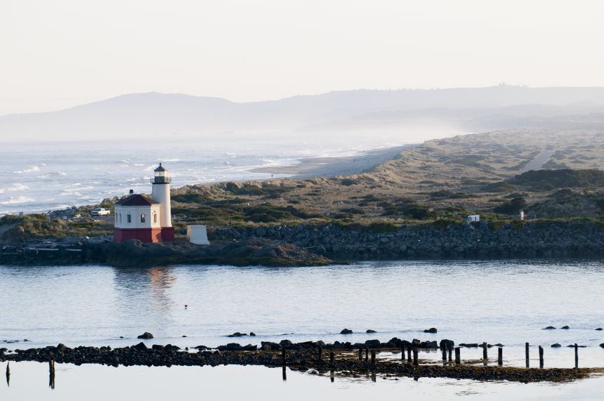 The historic Coquille Lighthouse, built in 1896, stands at the mouth of the Coquille River in the small coastal town of Bandon, Oregon.