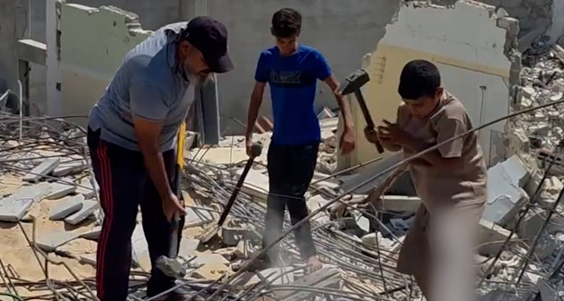Father and sons forced to manually clear rubble in Gaza | Israel-Palestine conflict News