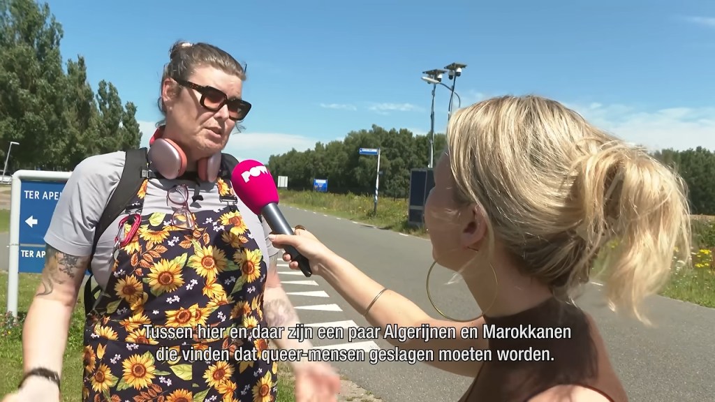 Jane-Michelle Arc being interviewed on Netherlands TV, wearing a sunflower print apron.