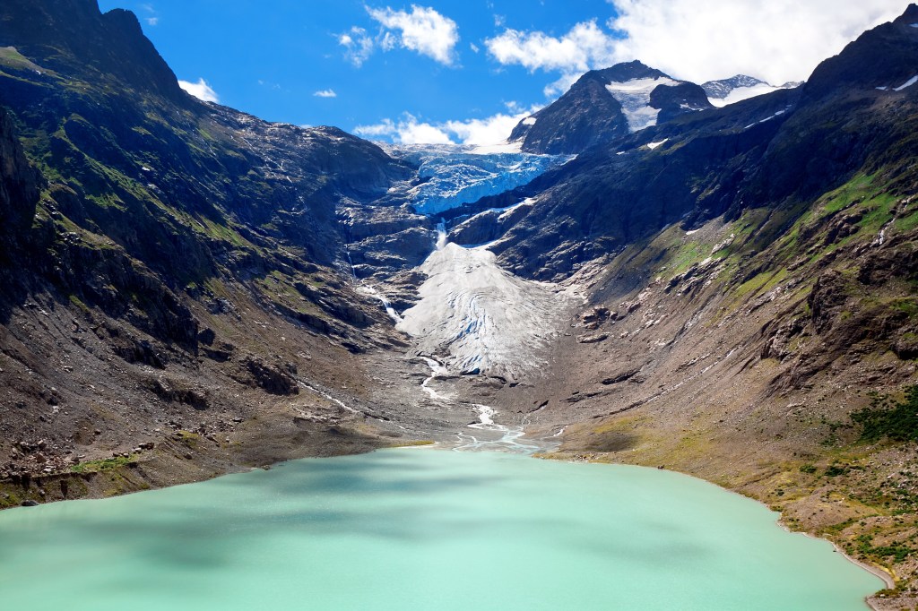 View of the Lake and Glacier Trift from a hanging bridge in the Alps, Canton of Berne, Switzerland.