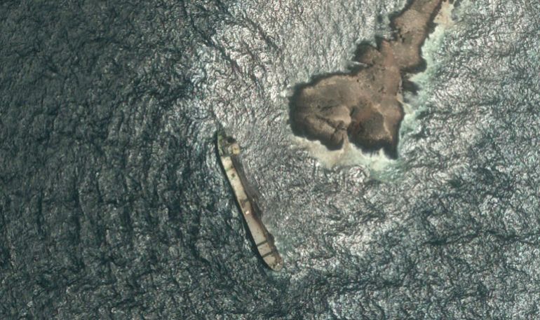A satellite photo shows the tanker Caroline Bezengi, grounded and partly submerged off the coast of Oman, on August 5, 2026