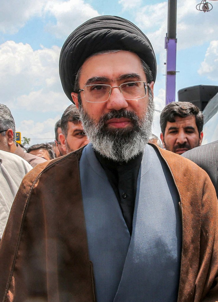 Mojtaba Khamenei, son of Iran's supreme leader Ayatollah Ali Khamenei, walks along a street in Tehran.
