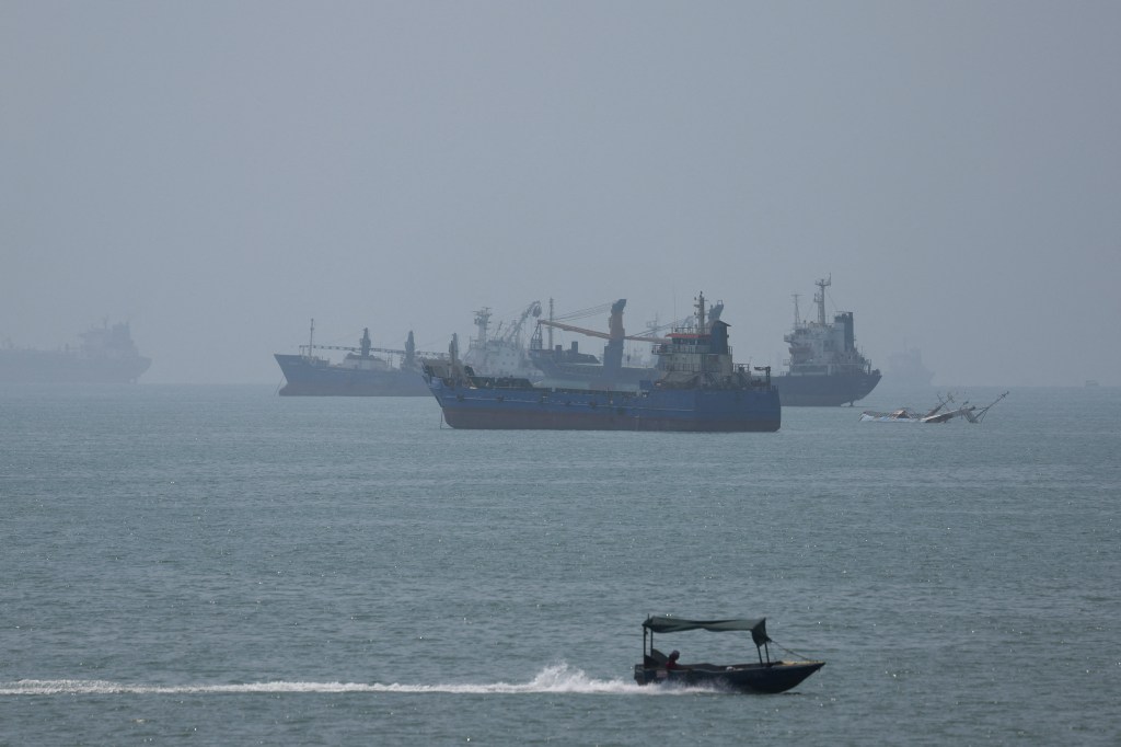 Vessels in the Strait of Hormuz are visible near the beach on Friday, August 28, 2026, in Bandar Abbas, Iran.