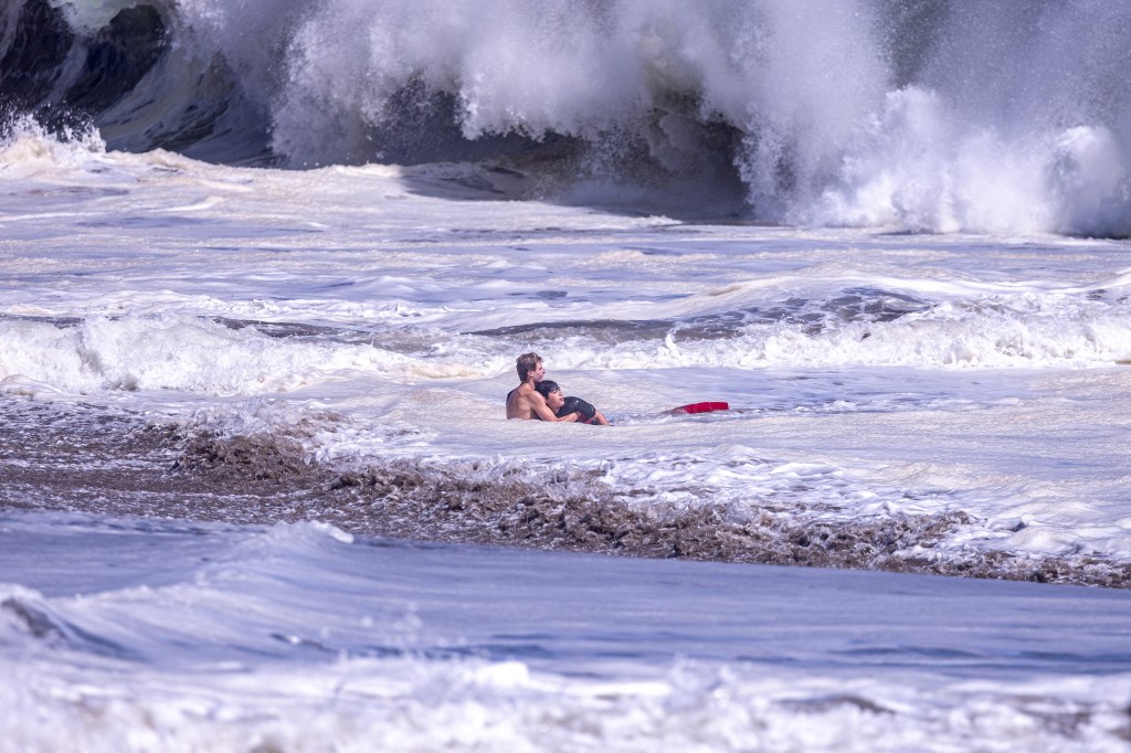 Lifeguard rescuing a boy at Seabright Beach.