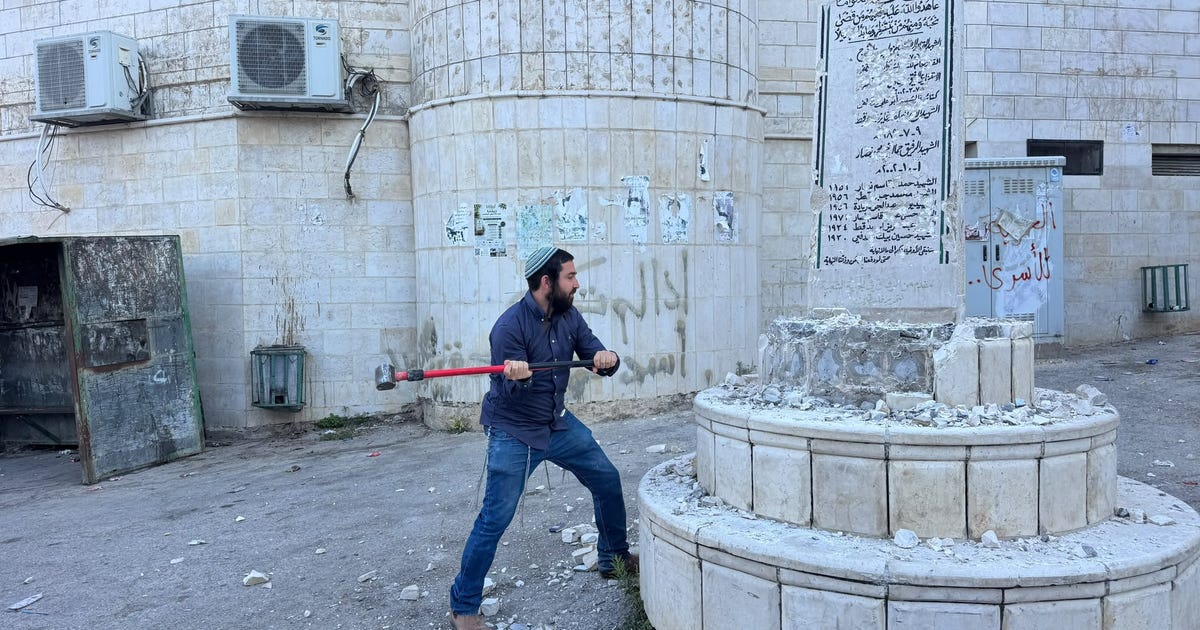Israeli lawmaker Tzvi Succot smashes Palestinian memorial guarded by IDF - Haaretz