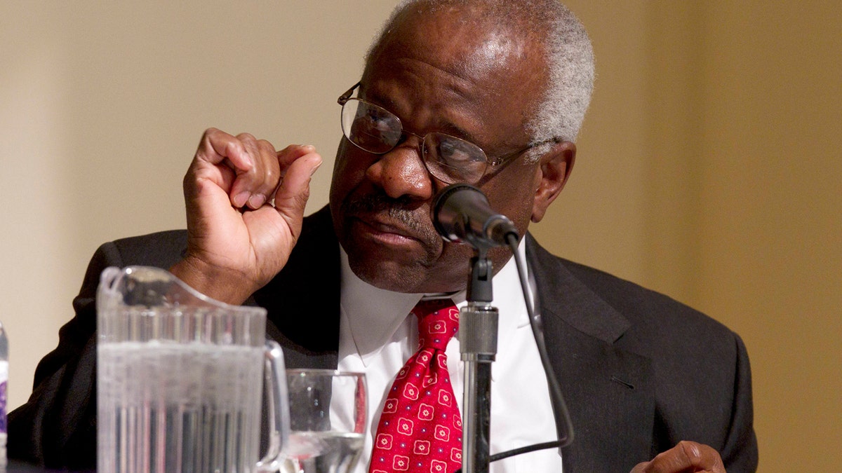 FILE - In this Jan. 26, 2012 file photo, Supreme Court Justice Clarence Thomas speaks at College of the Holy Cross in Worcester, Mass. Thomas says the Supreme Court confirmation process is an example of how the nations capital is broken in some ways. Thomas reflected Oct. 26, 2016, on his 25 years as a justice, at the Heritage Foundation, the conservative think tank where his wife once worked. (AP Photo/Michael Dwyer, File)