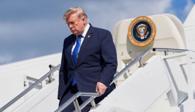 President Donald Trump exits Air Force One at Morristown Municipal Airport in Morristown, N.J., Friday, July 31, 2026, after a trip to Camp David, the presidential retreat. (AP Photo/Jacquelyn Martin)