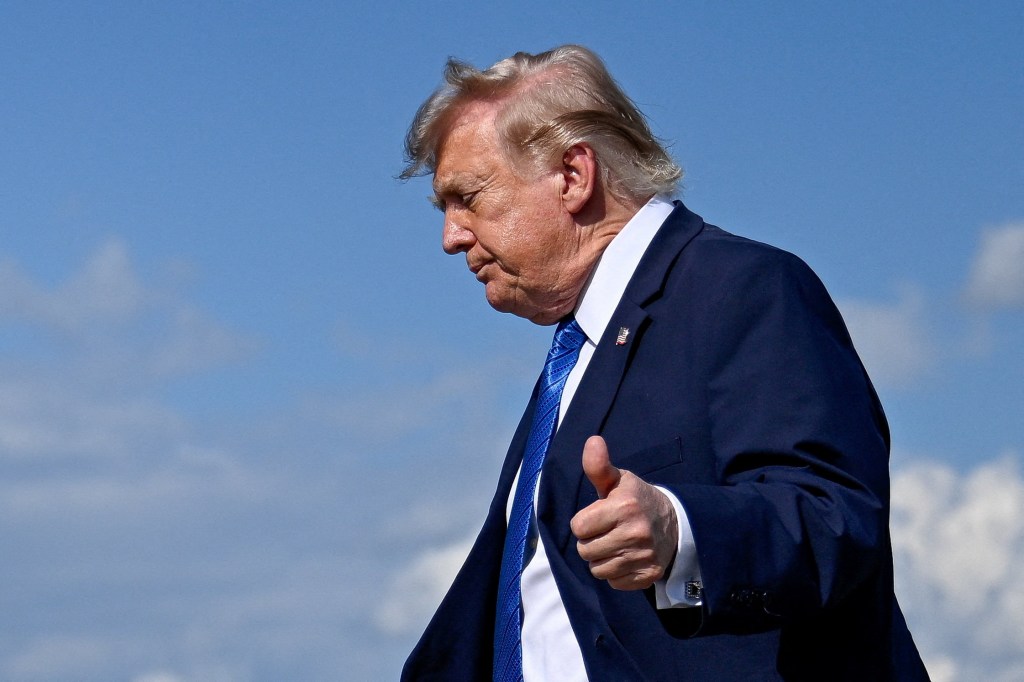 President Donald Trump gives a thumbs-up.