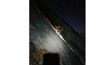 Volunteer rescuers in California spent hours scaling a mountain to reach a stranded climber