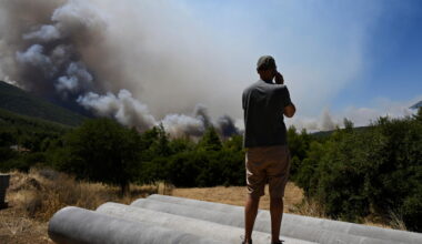 Photos show destruction from wildfires in Greece as blazes take hold in Europe and parts of the US