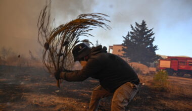 Water-dropping planes battle Athens wildfire after helicopter collision