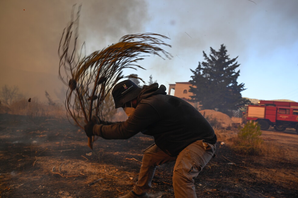 Water-dropping planes battle Athens wildfire after helicopter collision