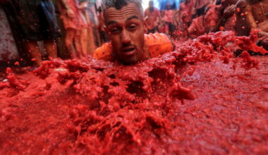 Photos show revelers pelting one another with tomatoes at Spain’s La Tomatina food fight