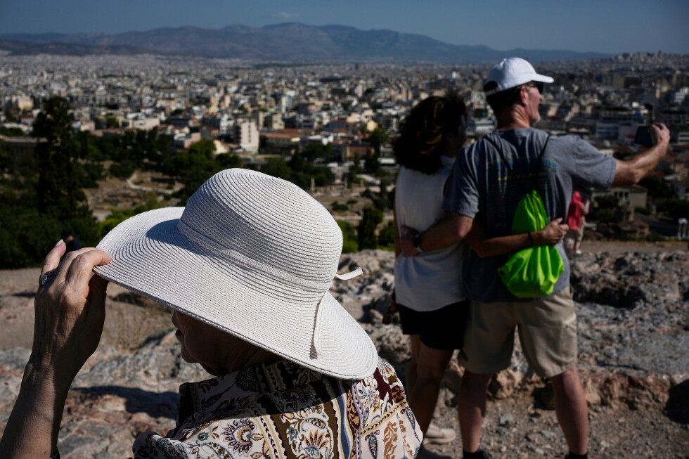 The sunhat is everywhere at tourist sites in Athens as Europe's heat intensifies