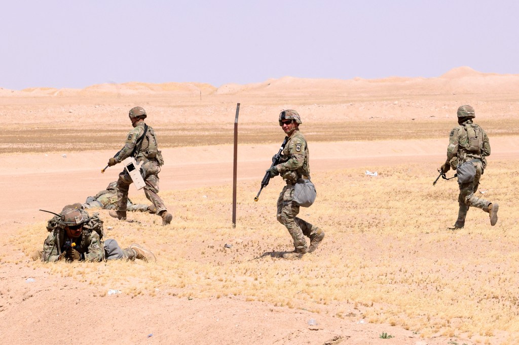 US military personnel participating in the Best Squad Competition.