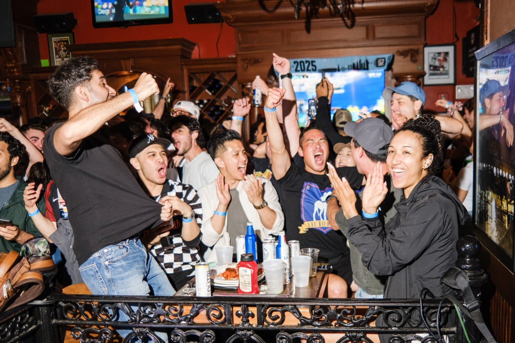 USA fans celebrate an early goal at Legends Bar in midtown Manhattan.