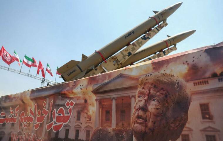 MAJID ASGARIPOUR/WEST ASIA NEWS AGENCY VIA REUTERS
A banner with a picture of President Donald Trump next to an Iranian missile system at Azadi Square in Tehran, Iran, on Thursday. Trump blamed the state of Minnesota and Gov. Tim Walz for the coordinated cyberattack on over 30 water systems across the state, even as officials say the attacks may have been carried out by Iran.