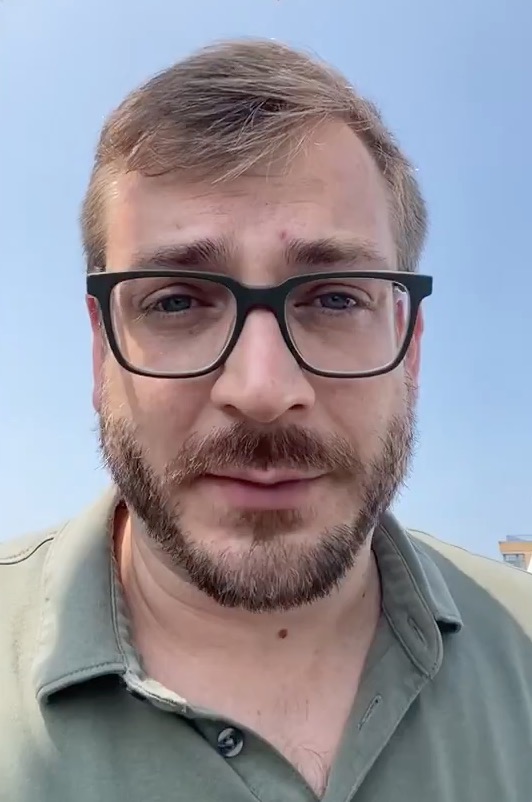 Adam O'Neal, Washington Post Opinion Editor, wearing glasses and a beard.