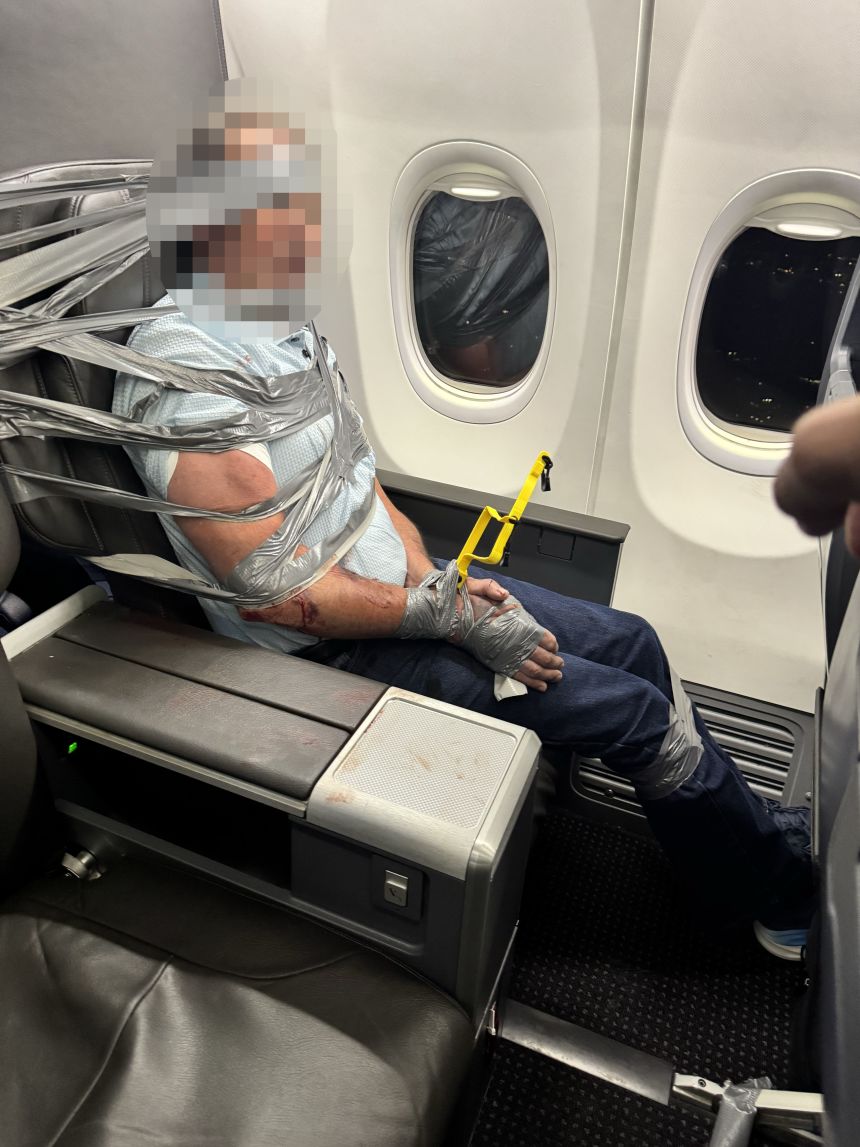 The unruly passenger was restrained until the flight landed and law enforcement officers were able to board the plane and remove him.