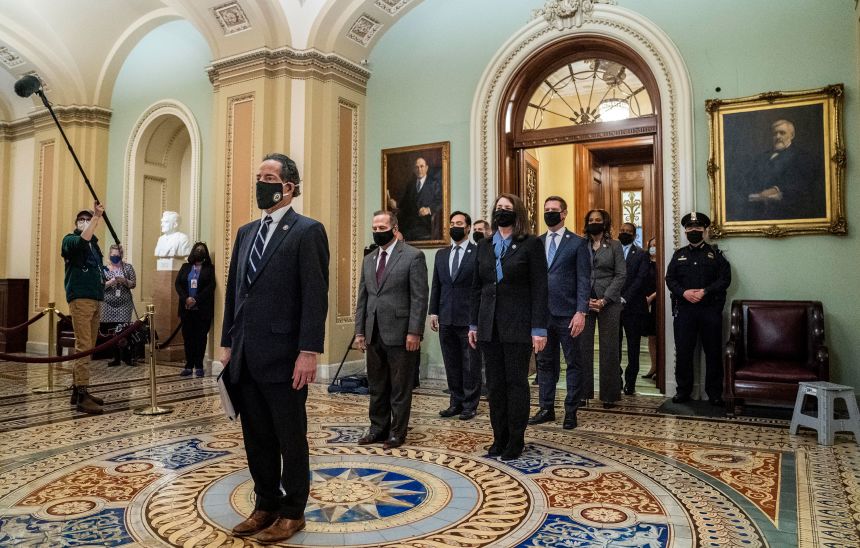 Impeachment managers Rep. Jamie Raskin, Diana DeGette, David Cicilline, Joaquin Castro, Eric Swalwell, Ted Lieu, Stacey Plaskett, Joe Neguse, and Madeleine Dean leave the Senate floor after delivering the article of impeachment on Capitol Hill on January 25, 2021.