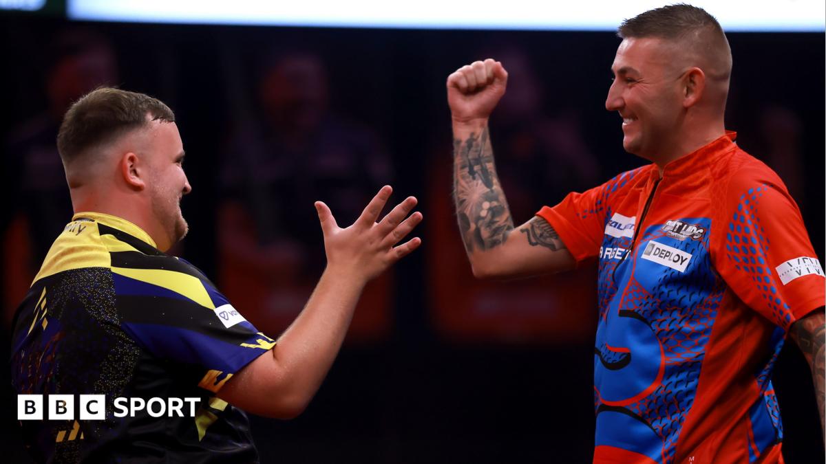 Luke Littler and Nathan Aspinall prepare to shake hands at the end of their match
