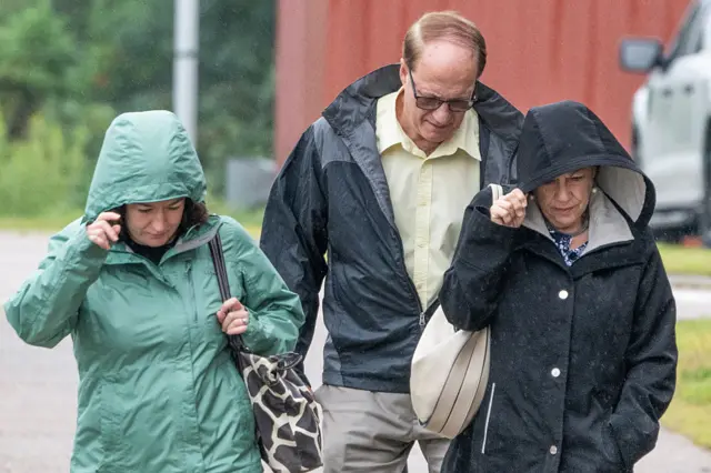 Paula Musgrove (right) and Michael Musgrove (centre), parents of Lindsay Clancy, walk with Allison Ozga (left), sister of Lindsay Clancy, as they arrive at the courthouse as the jury deliberation phase continues.