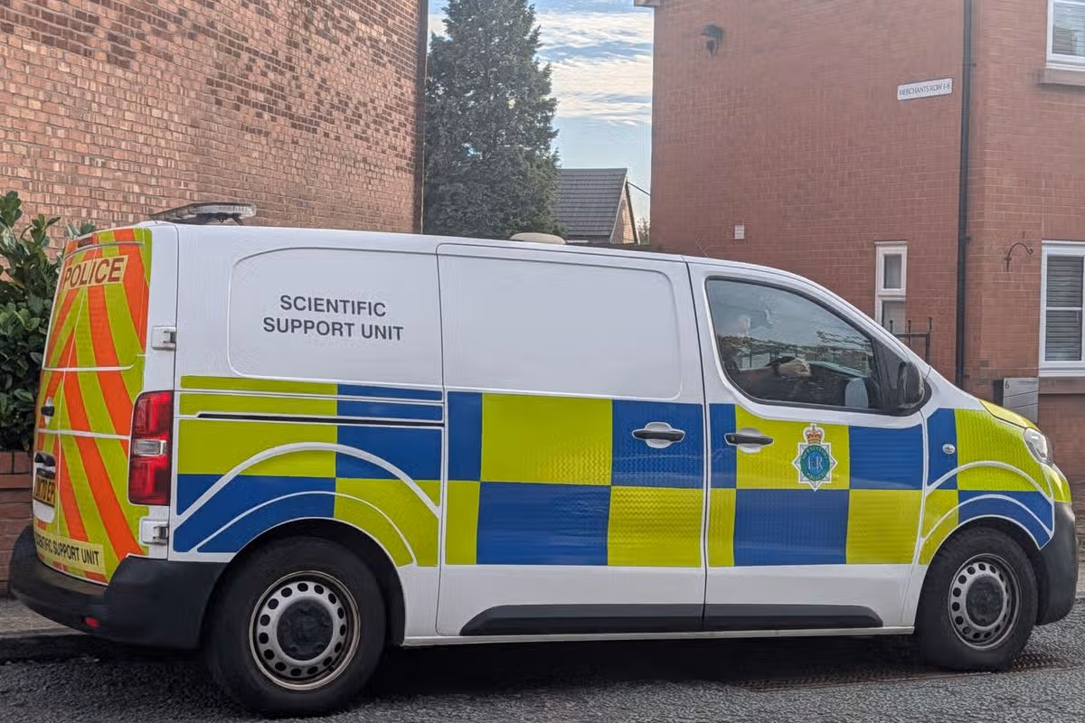 Forensic officers on Scotchbarn Lane in Prescot after a man was stabbed