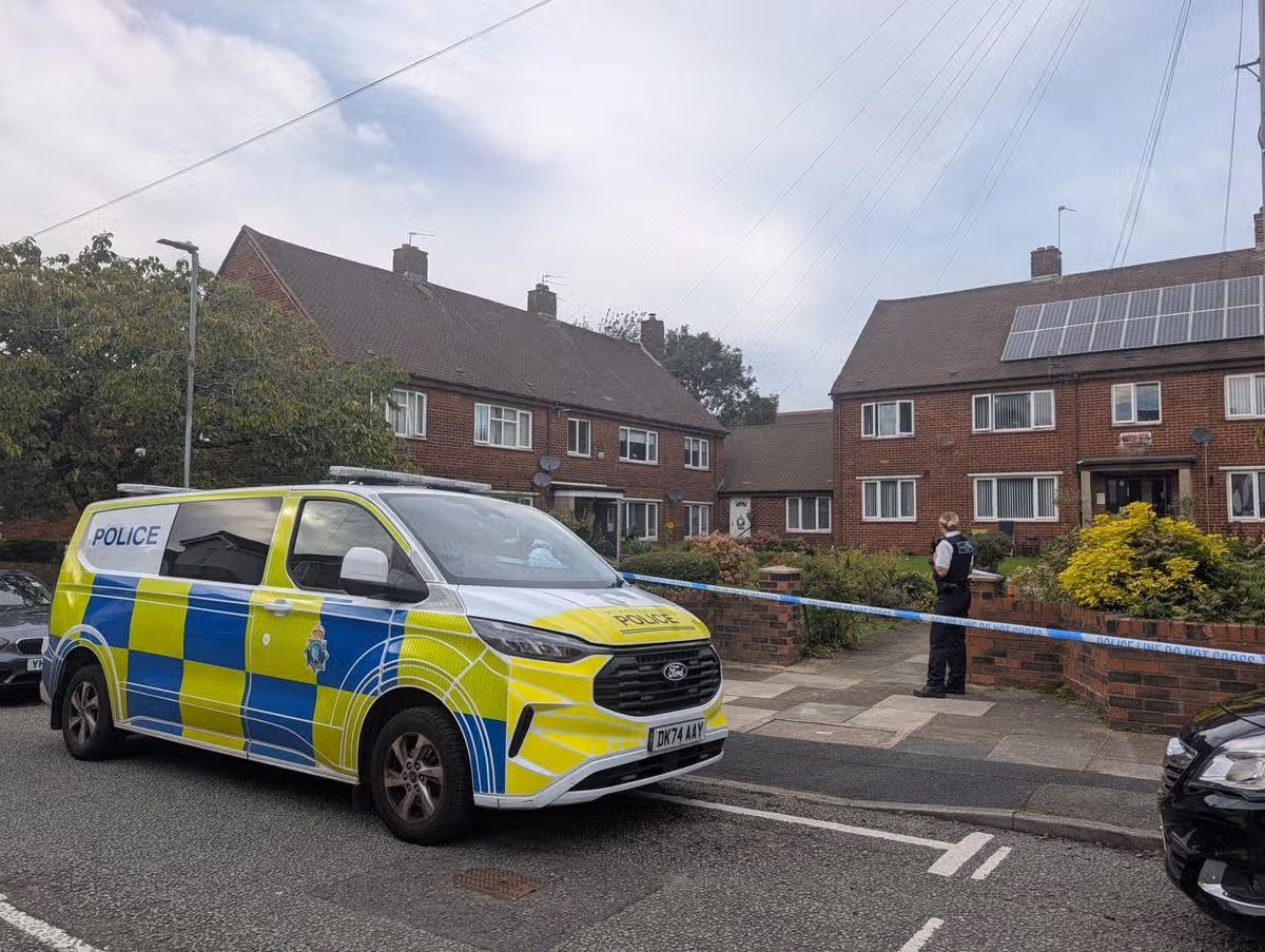 Police outside Fairhurst Terrace flats on Scotchbarn Lane, Prescot