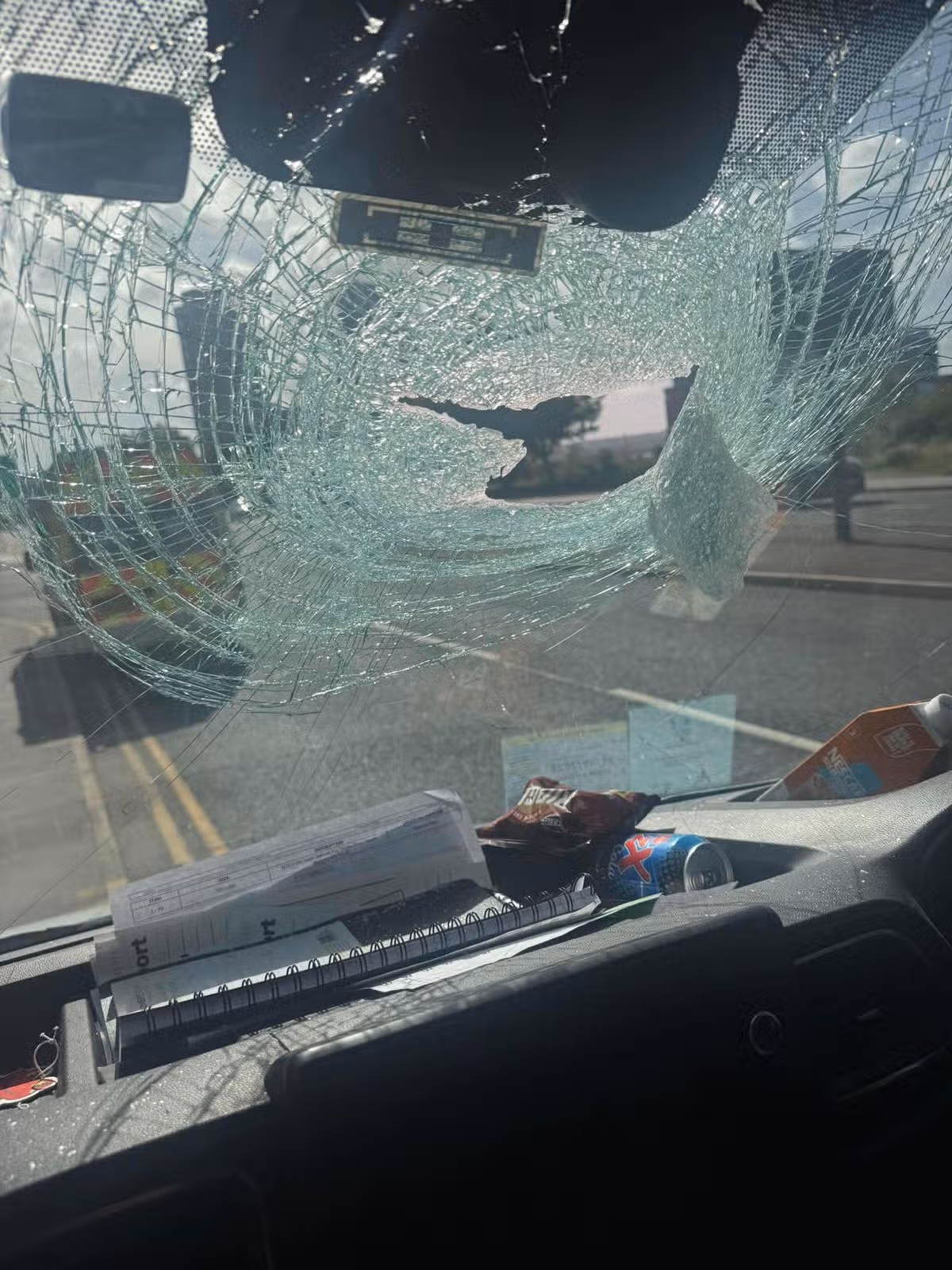 The damaged windscreen after a brick was hurled at the van