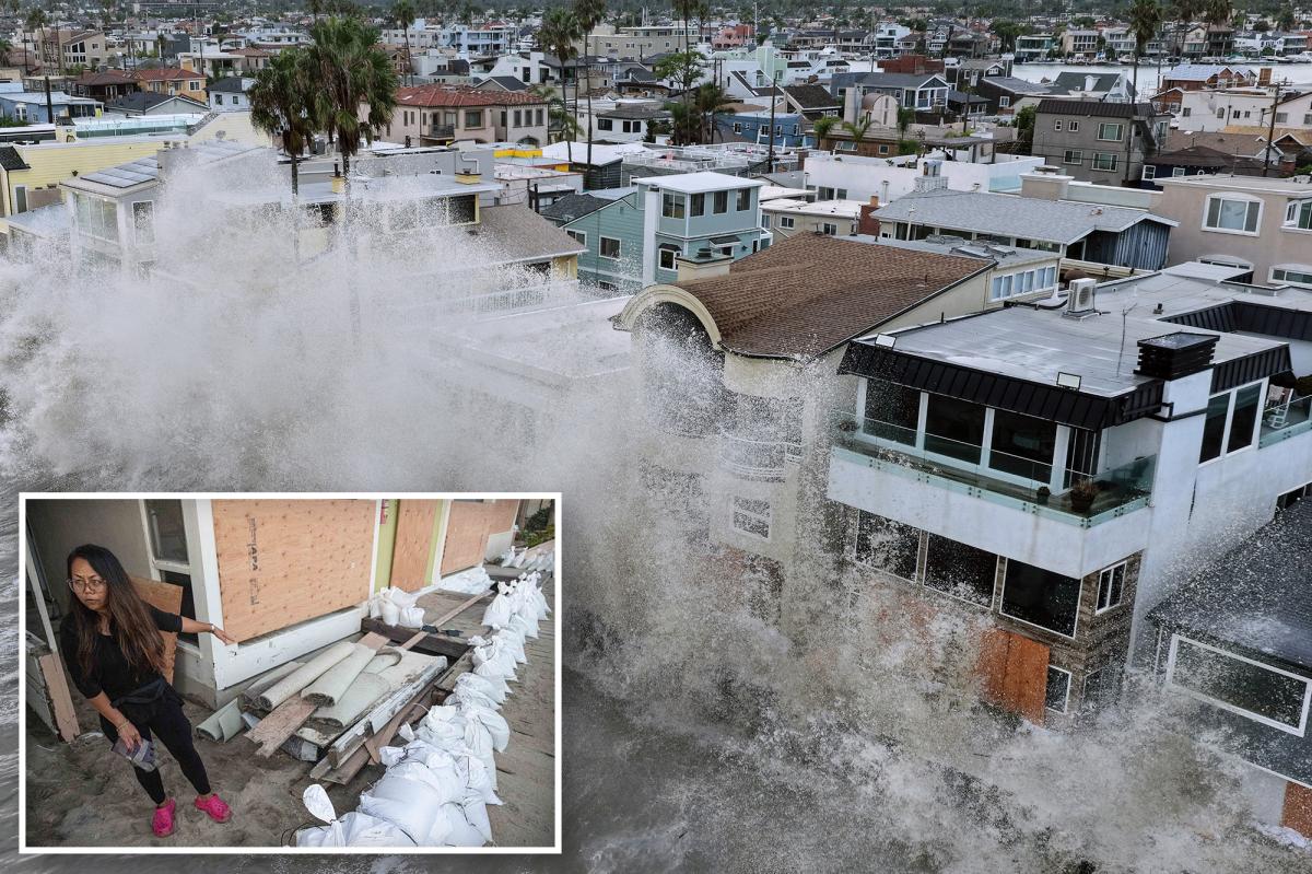 Long Beach homeowners flee as 12-foot waves smash seawall, flood homes and destroy cars