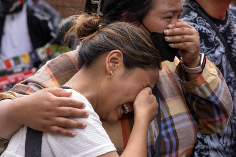 Relatives of victims and missing people react outside the morgue of the Tribhuvan University Teaching Hospital (TUTH), in Kathmandu, Nepal, August 29, 2026