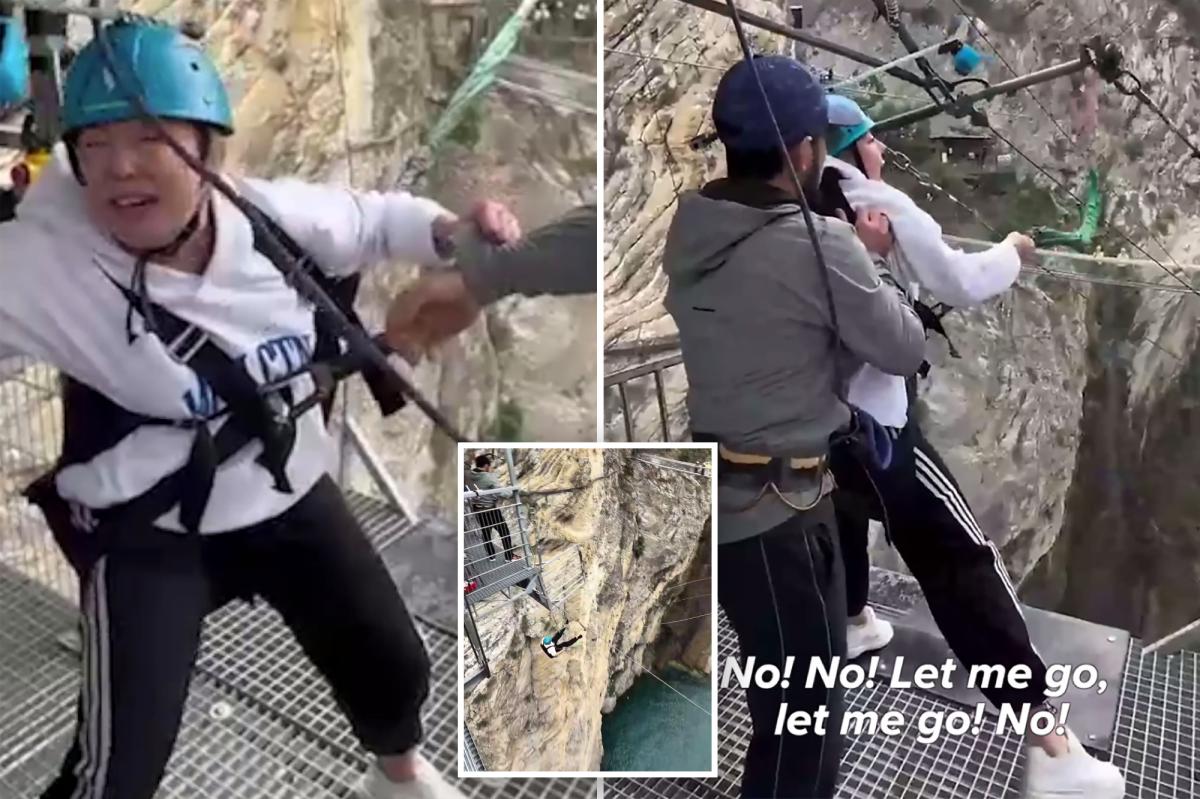 Shocking moment staffers kick terrified woman's legs away to make her take 260-foot thrill jump