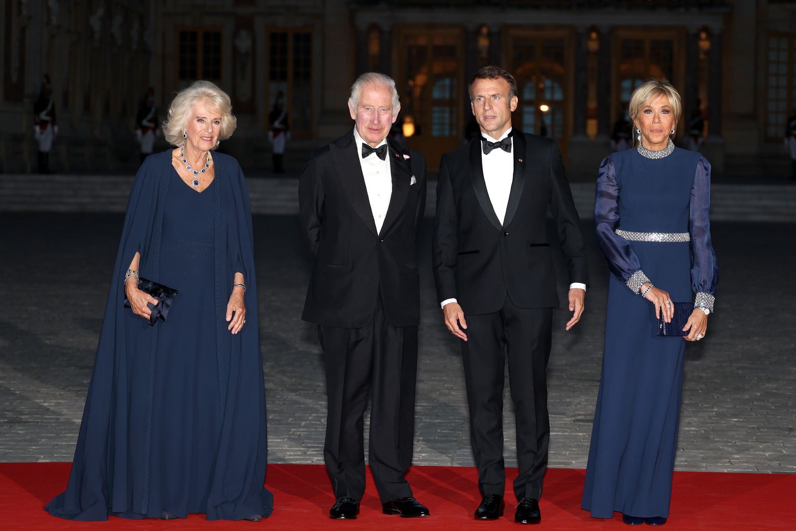Image may contain Charles Prince of Wales Emmanuel Macron Fashion Person Adult Clothing Formal Wear Suit and Coat