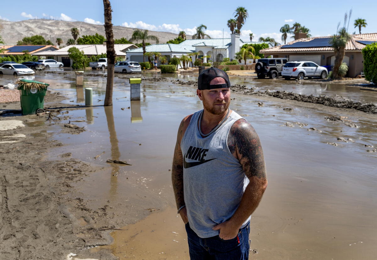 Man standing in floodwaters