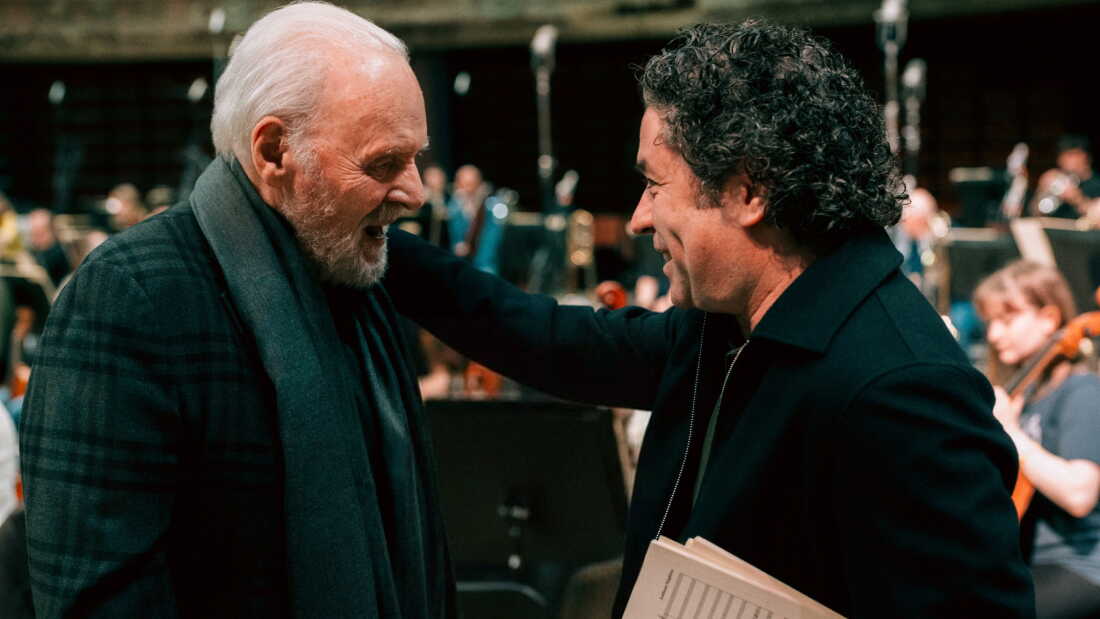 Oscar-winning actor Anthony Hopkins, left, calls music his “first love,” and has now released his debut album of orchestral works he’s composed over the course of six decades. Gustavo Dudamel, right, conducts London’s Philharmonia Orchestra for the recording.
