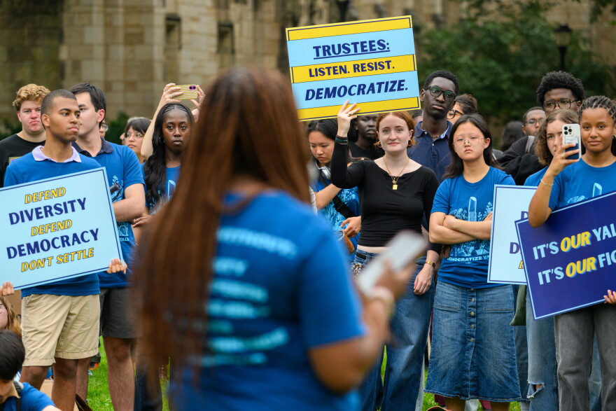 Yale students listen to Marah Rigaud, the school's president of the Black Student Alliance, speak during a teach-in at Yale protesting the Trump administration's efforts to influence the university's admissions policies.