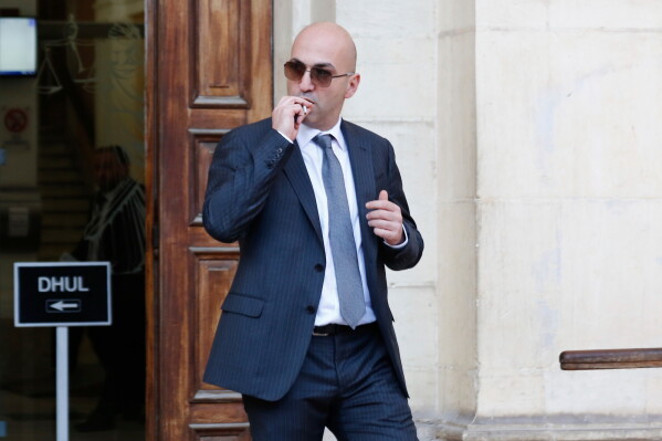 Maltese businessman Yorgen Fenech leaves court after being questioned in the 2017 bomb blast that killed investigative journalist Daphne Caruana Galizia as she drove near her home, Nov. 29, 2019, in Valletta, Malta. (AP Photo, File)