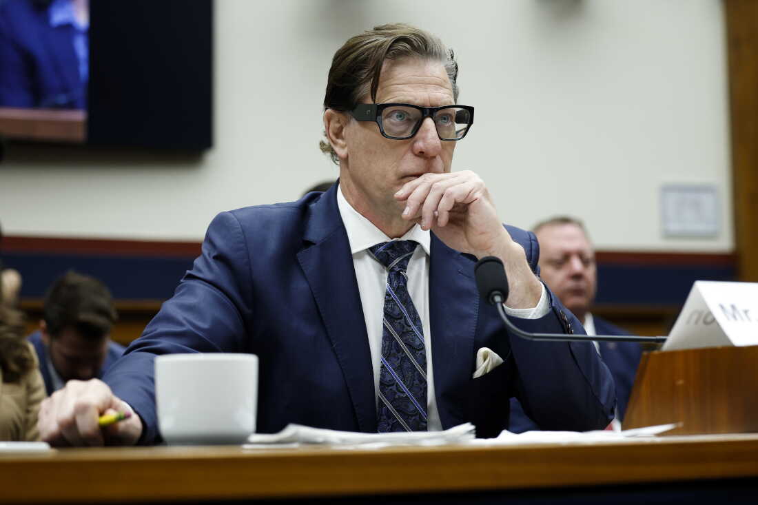 David Richardson testifies before Congress in 2025, when he was leading the Federal Emergency Management Agency (FEMA). He is wearing a navy suit, navy striped tie and glasses with thick, dark frames.
