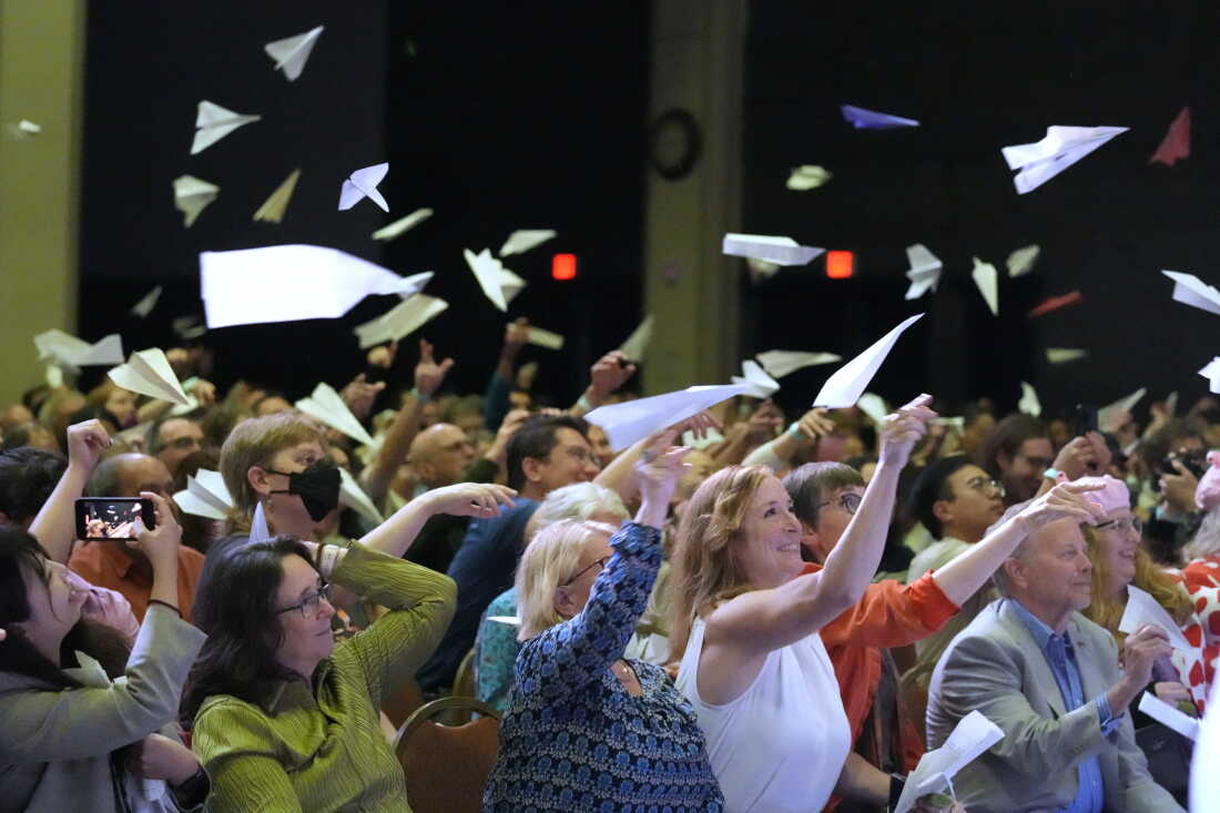 Audience members toss paper airplanes during the 2025 Ig Nobel Prize award ceremony in Boston, Mass.
