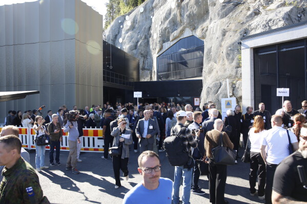 People outside the shelter at the beginning of civil defense exercise Shelter 2026 in Kuopio, Finland, Wednesday, Sept. 2, 2026. The exercise is testing how a large number of people can be protected in different types of disruption and during emergency conditions. (Matias Honkamaa/Lehtikuva via AP)