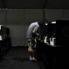 A voter casts a ballot at a vote center set up in a tent in Las Vegas on June 9.