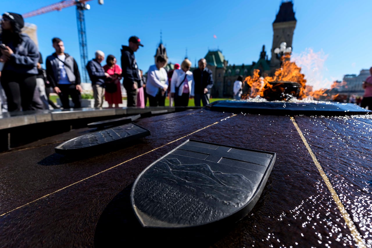 The provincial shield of Alberta is seen on the Centennial Flame on Parliament Hill