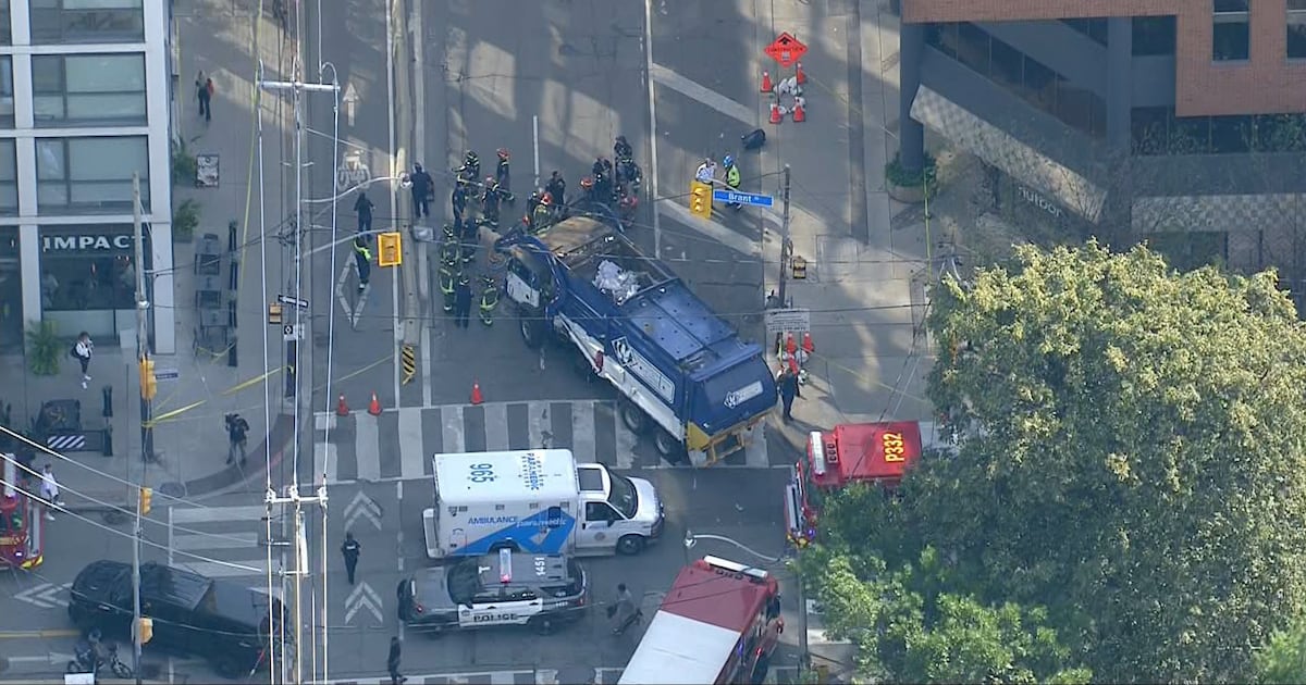 Pedestrian struck by garbage truck near Adelaide and Brant