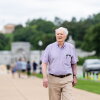 Shaun Byrnes, 83, a U.S. Navy veteran who served in Vietnam, arrives for an interview near Arlington National Cemetery in Arlington, Virginia on Monday, June 8, 2026. Public Citizen, representing Byrnes and other veterans, are suing the Trump administration to block construction of the proposed Triumphal Arch in Memorial Circle. (Eric Lee for NPR)