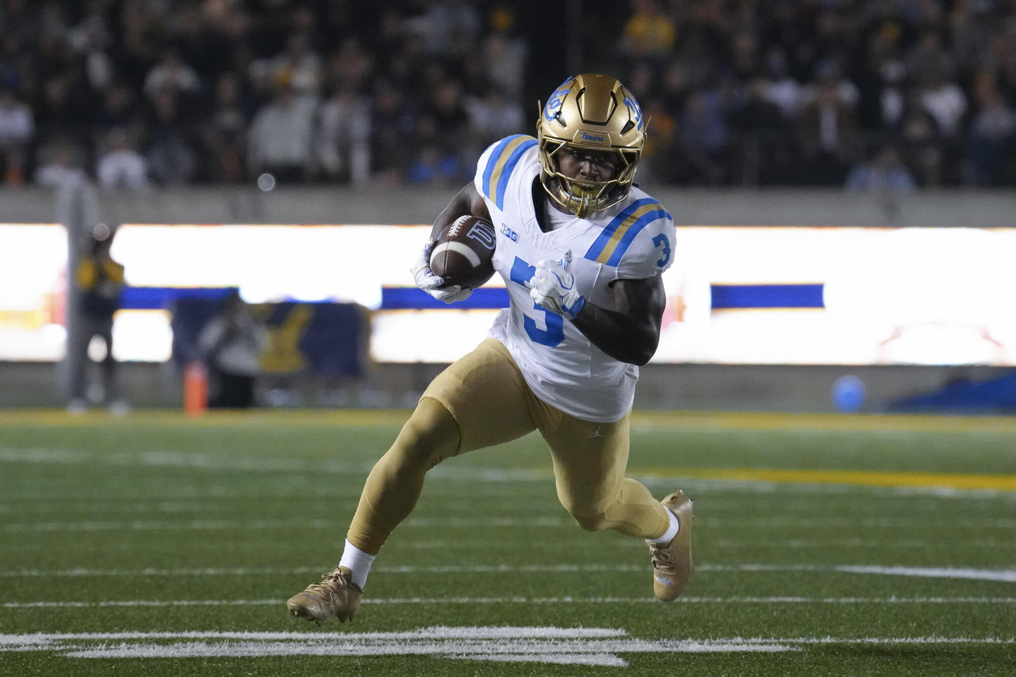 UCLA running back Wayne Knight carries the ball during a win over Cal on Saturday night.