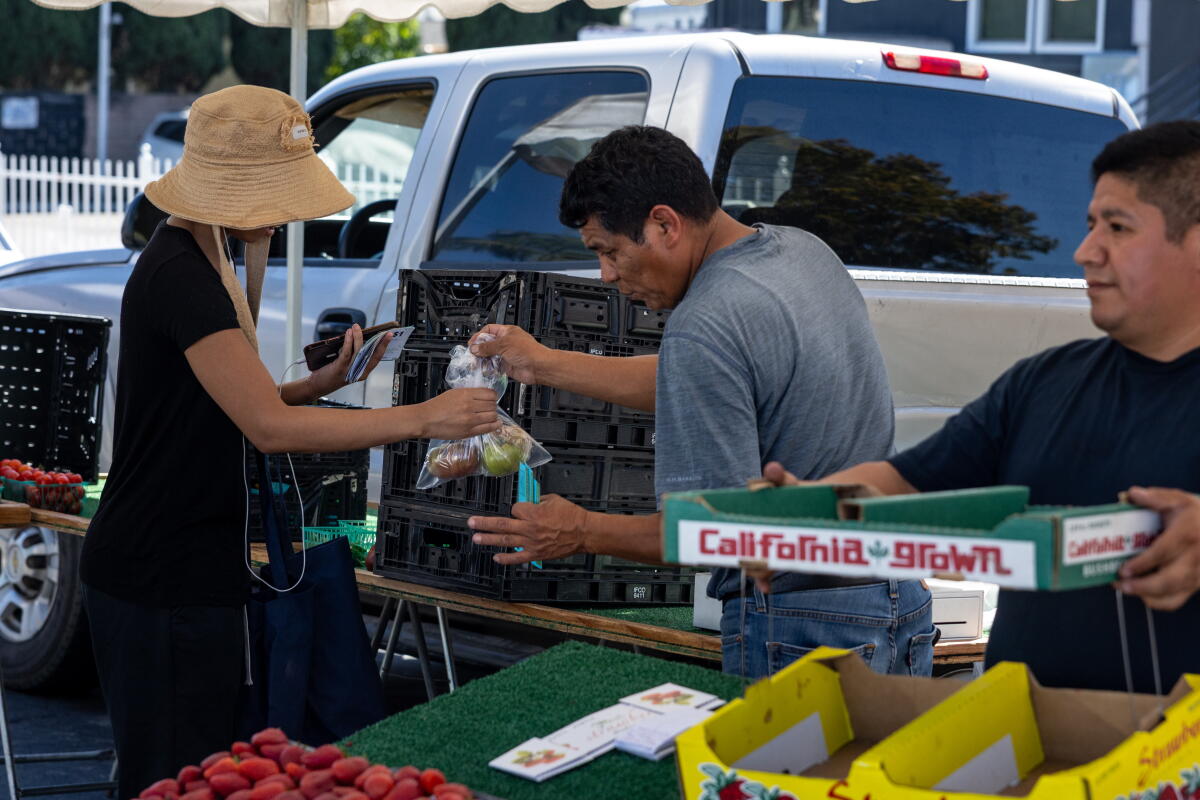 Shoppers at Lincoln Heights Certified Farmers Market in Los Angeles on Wednesday.