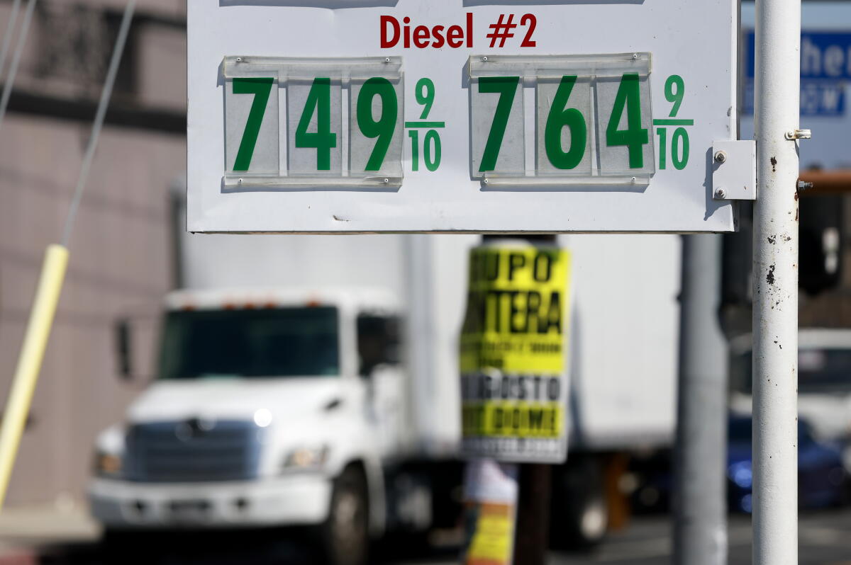 Diesel prices over $7 a gallon are displayed on a pump at a gas station