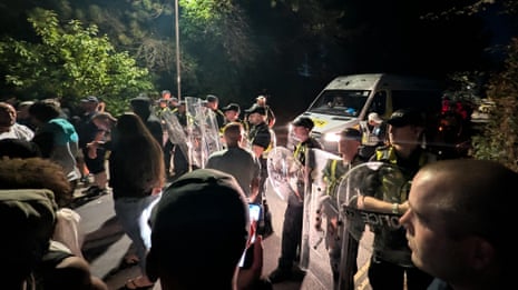 Riot police clash with far-right protesters in Portsmouth – video