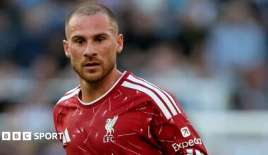 Liverpool midfielder Alexis Mac Allister, wearing the club's red home kit, looks on during a Premier League game